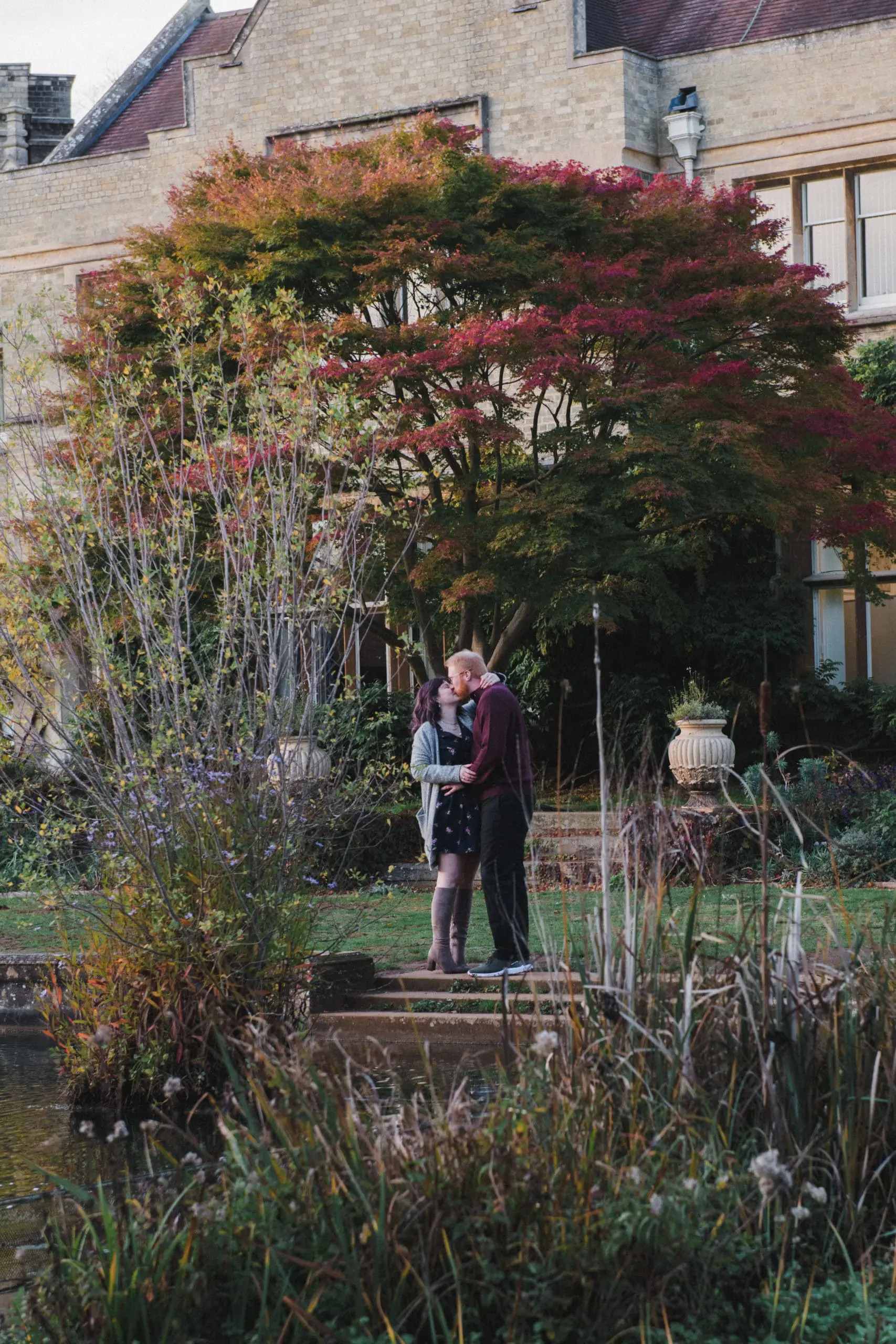 _DSC6308 A couple in the grounds of a large house kissing