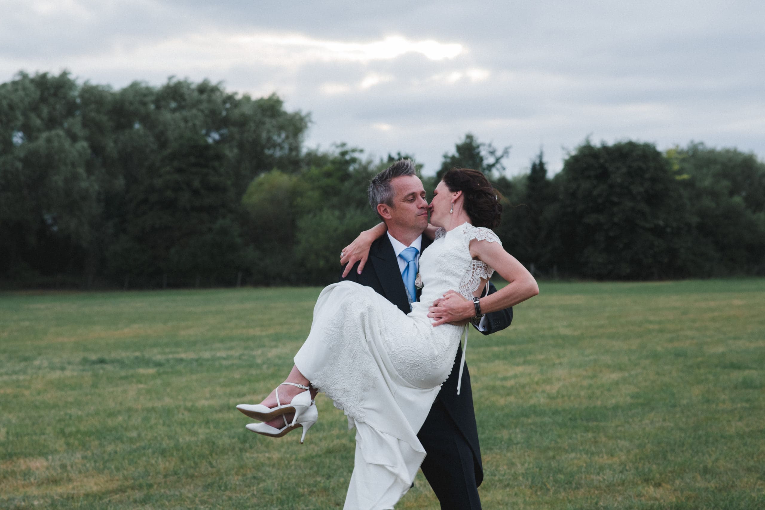 Bride being lifted