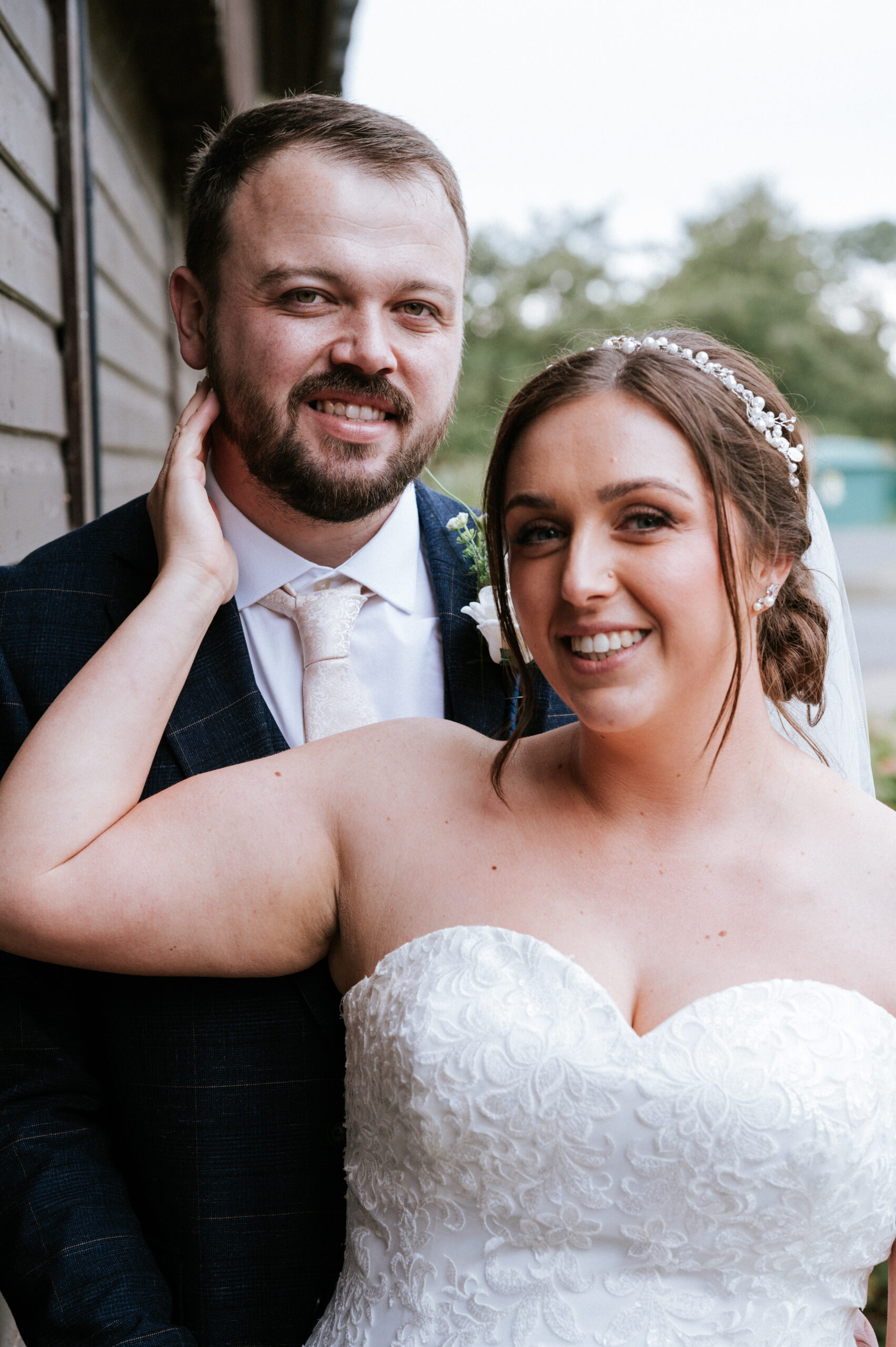 Wedding Photographer In Bedfordshire - a male and female bridal couple close up looking into the camera