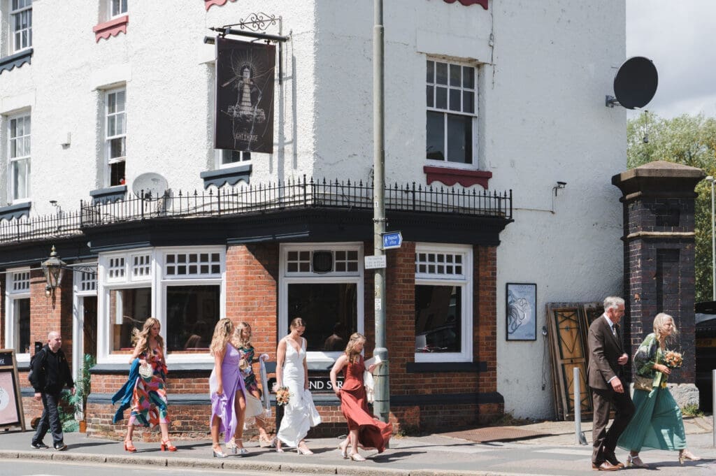 Oxfordshire Wedding Photographer - the wedding party strolling through the streets of Oxford