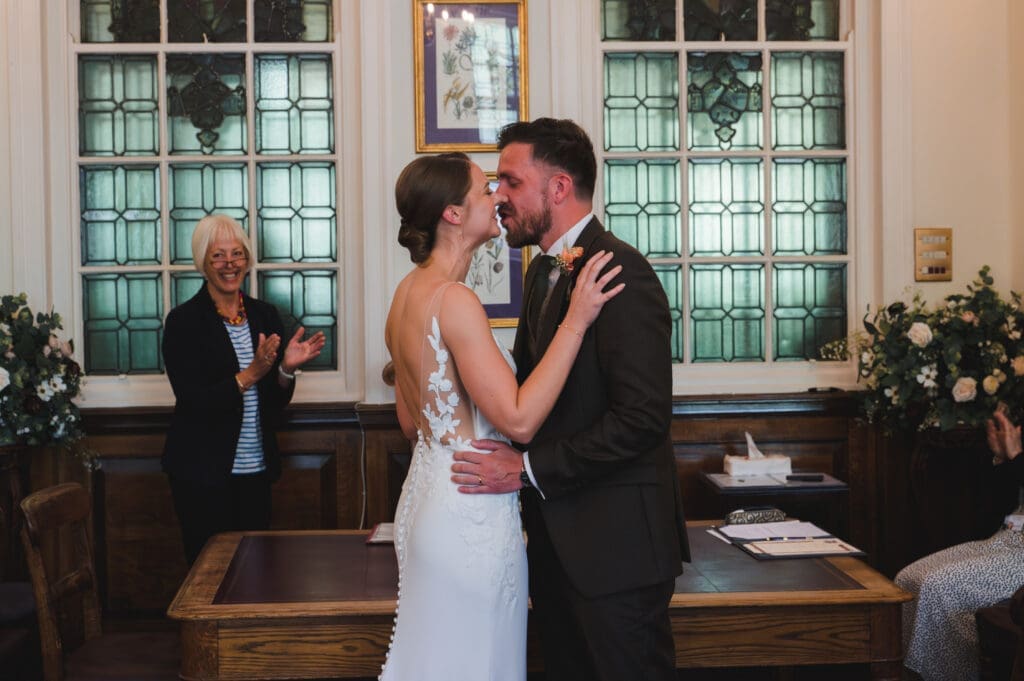 Oxfordshire Wedding Photographer - The couple seal their marriage with a kiss