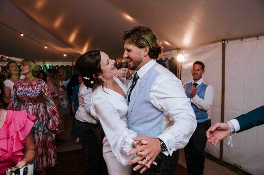 Newlay married bride and groom dancing with their wedding entertainment