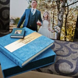 wedding album investment, a blue album on top of it's matching blue box with a bridal print in the background